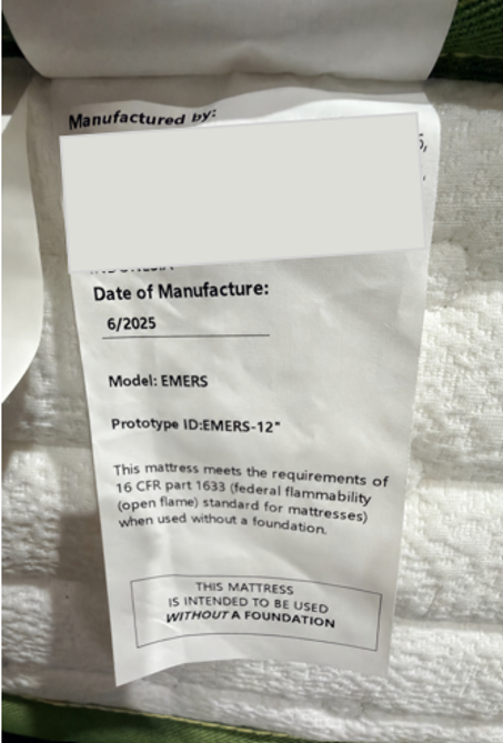 “Prototype ID: ” and the manufacture date “6/2025” are printed on a sewn-in white label located on one side of the mattress.